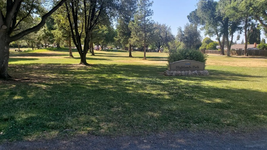A playground and open field at Highlands Park, Clayton Valley Highlands, Concord, CA 94521.